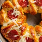 Pizza Monkey Bread is a fun and delicious twist on traditional monkey bread, combining all the flavors of pizza in a pull-apart bread that's perfect for sharing. This recipe is ideal for parties, game days, or any casual gathering. The combination of gooey cheese, savory pepperoni, and fragrant Italian seasoning makes this dish irresistible. Let's get started on making this tasty treat!