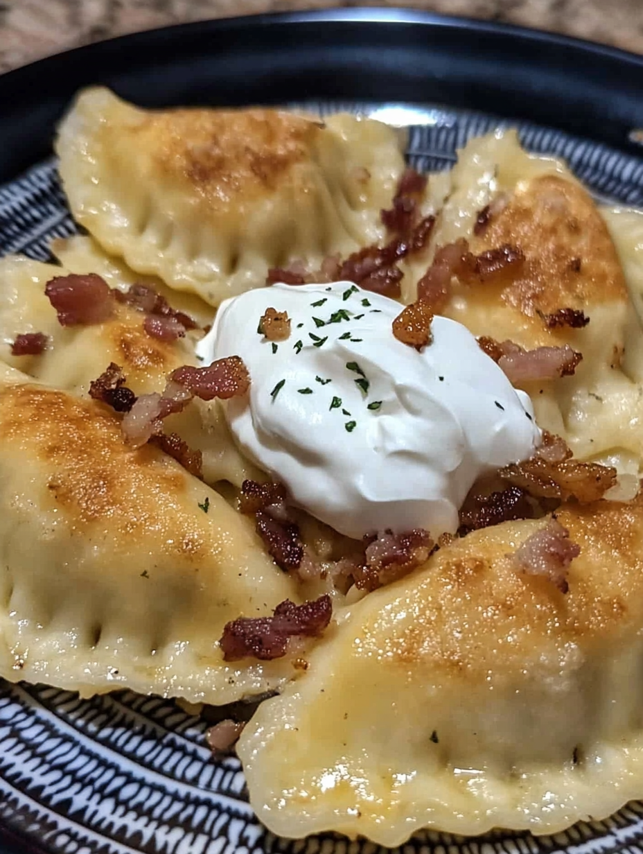 Homemade pierogi with bacon onion and sour cream